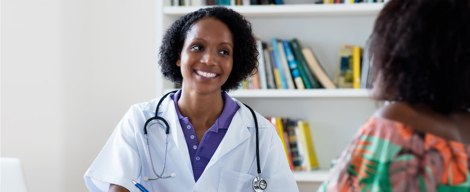 A doctor smiling at her patient