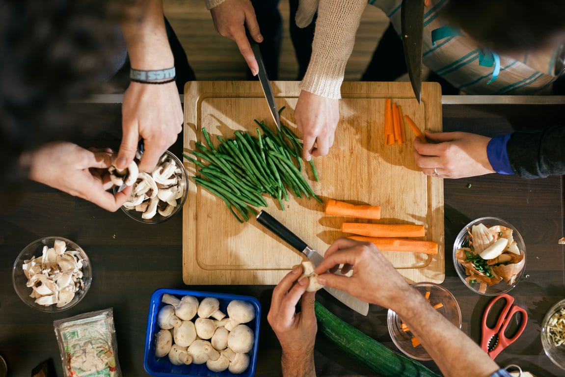 A group of people preparing a healthy meal