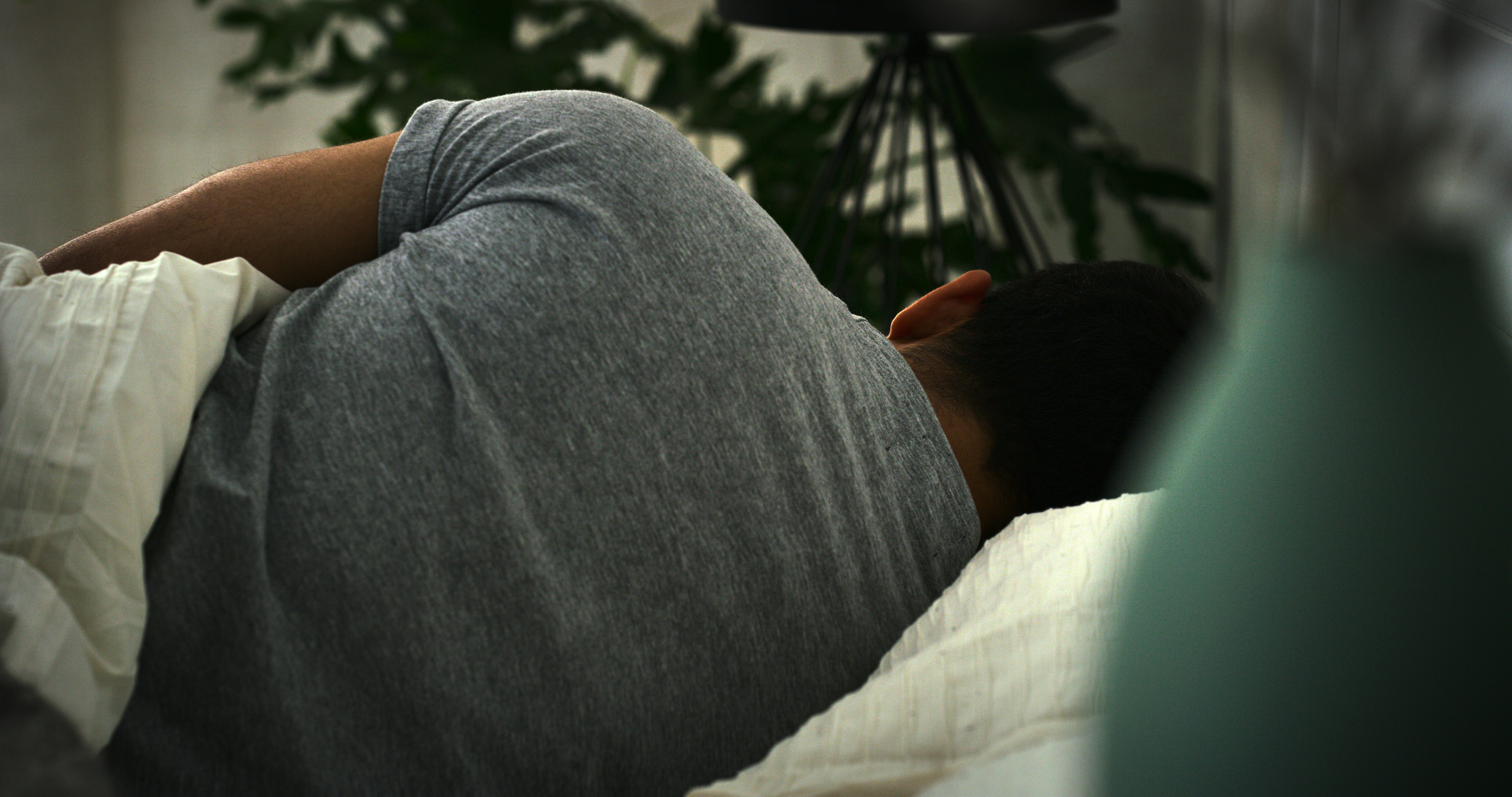 A man asleep on his side