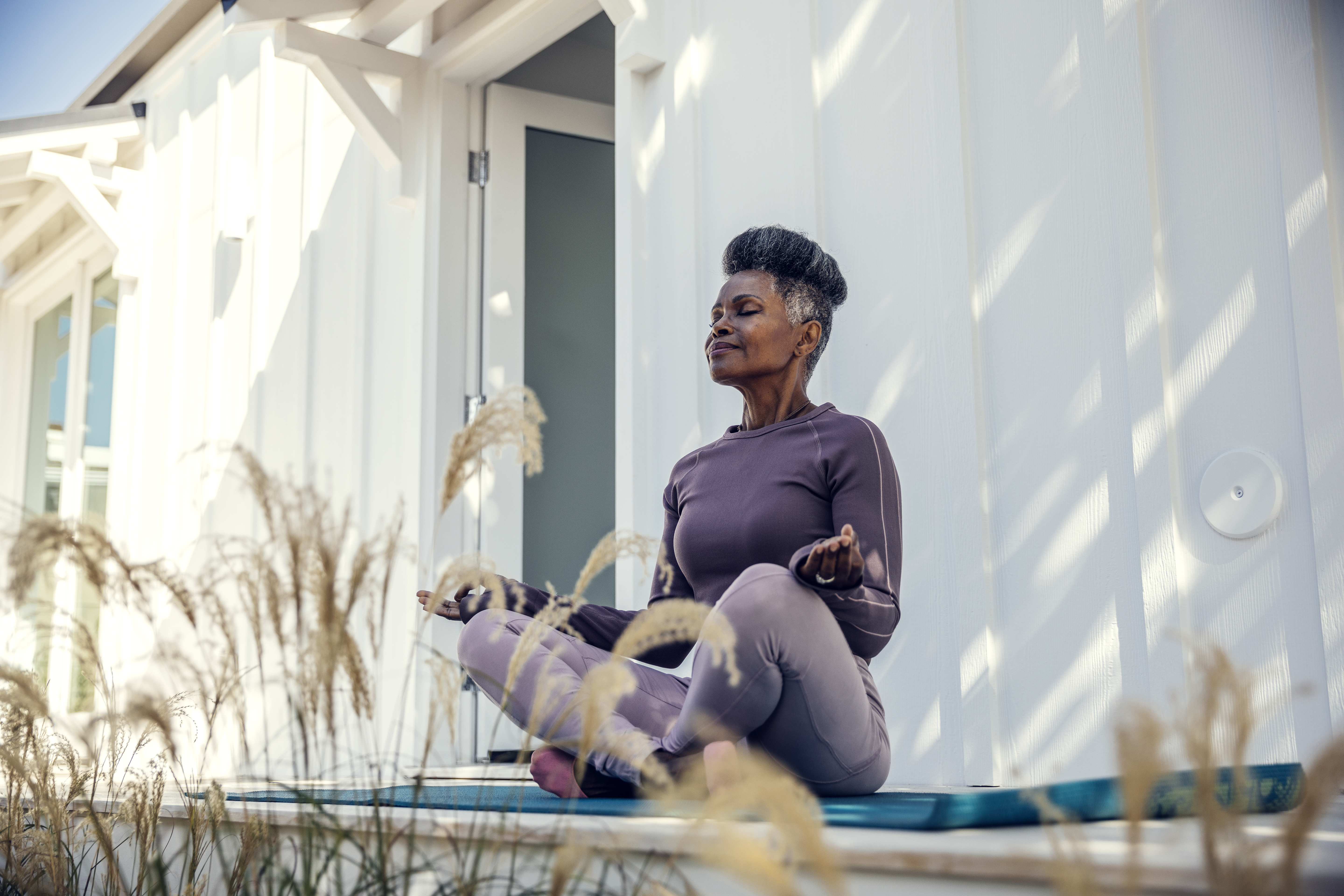 A woman meditating outdoors